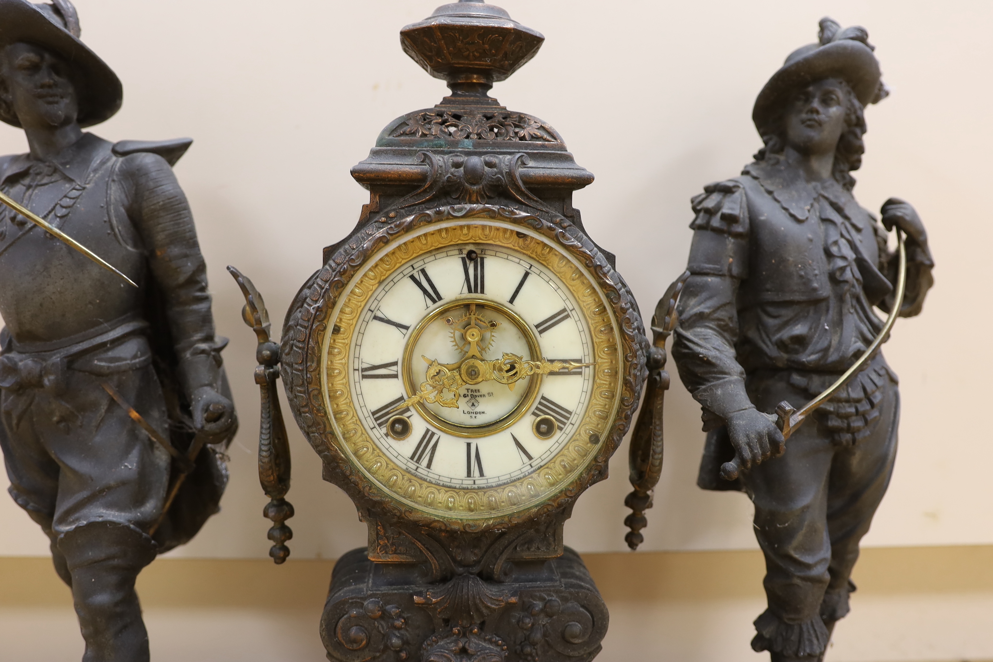 A 20th century American spelter and Cavalier figural mantel clock, 52cm high